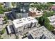 Building exterior with parking area and cityscape in the background at 317 W Morgan St # 320, Raleigh, NC 27601
