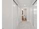 Hallway shows access to bathroom via doorway between closets with white sliding doors at 317 W Morgan St # 320, Raleigh, NC 27601