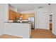Bright kitchen features stainless steel appliances, wood cabinets, and a breakfast bar at 317 W Morgan St # 320, Raleigh, NC 27601