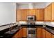 Updated kitchen features stainless steel appliances, wood cabinets and granite countertops at 317 W Morgan St # 320, Raleigh, NC 27601