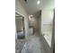 Bathroom featuring a soaking tub with shower, granite counters and a single-sink vanity at 322 Busterfield Ct, Benson, NC 27504