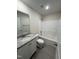 Bright bathroom features a shower-tub combo, tiled floor, granite topped vanity, and recessed lighting at 322 Busterfield Ct, Benson, NC 27504