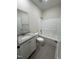 Bathroom featuring a tub-shower, granite counters and a single-sink vanity at 322 Busterfield Ct, Benson, NC 27504