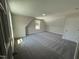 Spacious bedroom featuring a patterned carpet, bright natural light, and neutral wall colors at 322 Busterfield Ct, Benson, NC 27504
