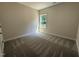 Bedroom featuring carpet floors and one window at 322 Busterfield Ct, Benson, NC 27504