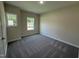 Bedroom featuring carpet floors and two windows at 322 Busterfield Ct, Benson, NC 27504