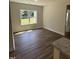 Bright dining area with wood floors and large window offering outdoor views at 322 Busterfield Ct, Benson, NC 27504