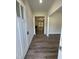 Bright entryway showcasing wood floors that lead into a living room with a fireplace at 322 Busterfield Ct, Benson, NC 27504