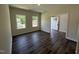 Sunlit flex room with dark wood floors, a large window, and a view to the front door at 322 Busterfield Ct, Benson, NC 27504