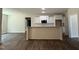 Kitchen featuring a breakfast bar, white cabinets, and a microwave at 322 Busterfield Ct, Benson, NC 27504