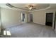 Spacious main bedroom featuring carpet floors and ensuite bath access at 322 Busterfield Ct, Benson, NC 27504