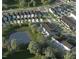 Aerial view of a neighborhood with diverse home styles and a pond at 330 Cottage Hill Way, Knightdale, NC 27604