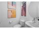 Elegant bathroom with modern fixtures, including a sleek toilet and a sink with a minimalist faucet at 330 Cottage Hill Way, Knightdale, NC 27604