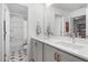 Spacious bathroom with a double vanity, modern fixtures, and stylish tile flooring leading to more bathroom spaces at 330 Cottage Hill Way, Knightdale, NC 27604