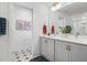 Modern bathroom with double vanity, stylish fixtures, and decorative tile work for a sophisticated touch at 330 Cottage Hill Way, Knightdale, NC 27604