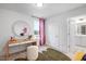 Bright bedroom features a stylish vanity area, large window, and unique decorative elements at 330 Cottage Hill Way, Knightdale, NC 27604