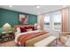 Inviting bedroom with a plush bed, colorful decor, and large windows offering scenic views at 330 Cottage Hill Way, Knightdale, NC 27604