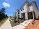 New home features modern design, manicured landscaping, and convenient sidewalk access in a desirable community at 330 Cottage Hill Way, Knightdale, NC 27604