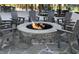 Outdoor firepit with stone surround and Adirondack chairs at 330 Cottage Hill Way, Knightdale, NC 27604