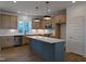 Modern kitchen with stainless steel appliances, ample counter space, and a large island at 330 Cottage Hill Way, Knightdale, NC 27604