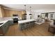 Bright, modern kitchen with an island, stainless steel appliances, and an open floor plan at 330 Cottage Hill Way, Knightdale, NC 27604