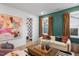 Bright living room featuring a cream sofa and colorful accents with a glimpse into a tiled entryway at 330 Cottage Hill Way, Knightdale, NC 27604