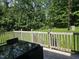 Inviting wood patio with dining table, offering views of the lawn at 3510 Rawdon Dr, Durham, NC 27713