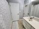 Bathroom featuring double sinks, neutral color palette, and tiled floors at 3510 Rawdon Dr, Durham, NC 27713