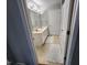 Bathroom featuring double sinks, neutral color palette, and tiled floors at 3510 Rawdon Dr, Durham, NC 27713
