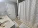 Bathroom featuring double sinks, neutral color palette, and tiled floors at 3510 Rawdon Dr, Durham, NC 27713