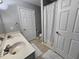 Bathroom featuring double sinks, neutral color palette, and tiled floors at 3510 Rawdon Dr, Durham, NC 27713