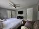 Cozy bedroom featuring neutral walls, closet doors, and ceiling fan at 3510 Rawdon Dr, Durham, NC 27713