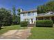 Charming two-story home with brick stairs, landscaped yard, and concrete driveway at 3510 Rawdon Dr, Durham, NC 27713