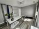 Bright home office with wood floors, large desk, and a white board for brainstorming at 3510 Rawdon Dr, Durham, NC 27713