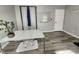 Bright home office with wood floors, large desk, and a white board for brainstorming at 3510 Rawdon Dr, Durham, NC 27713