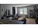 Inviting living room with a comfortable sectional sofa and stylish decor and shelving at 3510 Rawdon Dr, Durham, NC 27713