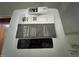 Close-up of a portable air conditioner unit with a user manual at 358 Pool Rock Shores Ln, Henderson, NC 27537