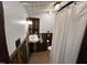 Rustic bathroom with wood paneling, custom shelves, and a vintage sink at 358 Pool Rock Shores Ln, Henderson, NC 27537