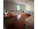 Open bedroom with hardwood flooring and dormer windows, with two beds at 358 Pool Rock Shores Ln, Henderson, NC 27537