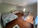 Spacious bedroom with hardwood floors and natural light at 358 Pool Rock Shores Ln, Henderson, NC 27537