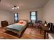 Bright bedroom with wood floors, natural light, and comfortable furnishings at 358 Pool Rock Shores Ln, Henderson, NC 27537