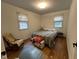 Inviting bedroom with warm wood flooring and natural light, creating a cozy atmosphere at 358 Pool Rock Shores Ln, Henderson, NC 27537