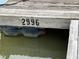 Close-up of a dock with the number '2996' painted on the side, over a floating dock support at 358 Pool Rock Shores Ln, Henderson, NC 27537