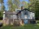Back exterior of house showing deck and stairs at 358 Pool Rock Shores Ln, Henderson, NC 27537
