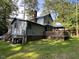 Back exterior of house with wood deck and gazebo at 358 Pool Rock Shores Ln, Henderson, NC 27537