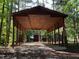 Exterior shot of open sided garage structure with surrounding trees at 358 Pool Rock Shores Ln, Henderson, NC 27537
