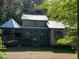 Charming home featuring a gazebo, covered porch and metal roof at 358 Pool Rock Shores Ln, Henderson, NC 27537
