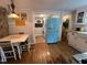 Country kitchen showcasing the retro blue refrigerator and adjacent laundry room at 358 Pool Rock Shores Ln, Henderson, NC 27537