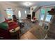 Cozy living room featuring a stone fireplace, hardwood floors, and unique architectural details at 358 Pool Rock Shores Ln, Henderson, NC 27537
