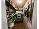 Walk-in pantry features ample shelving and organization for groceries and storage at 358 Pool Rock Shores Ln, Henderson, NC 27537
